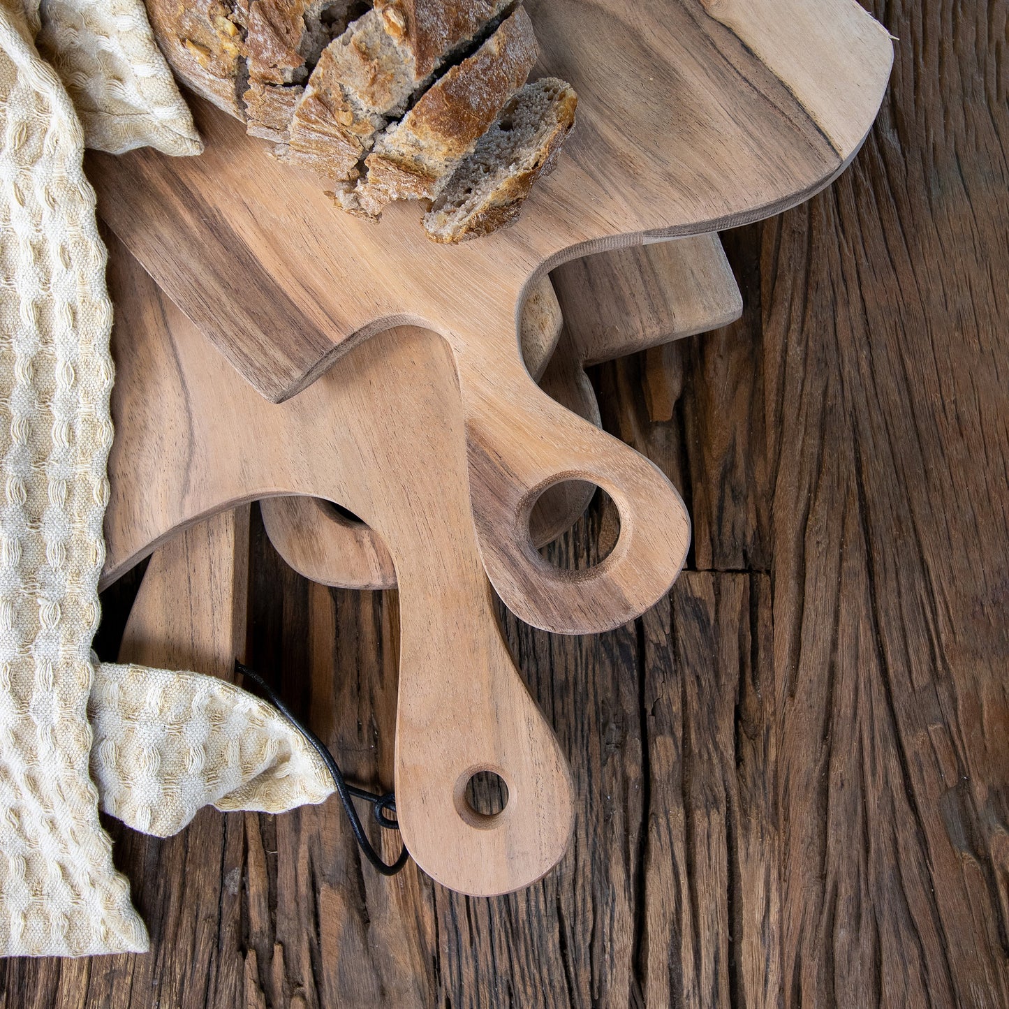 Acacia wood cutting boards in a pile