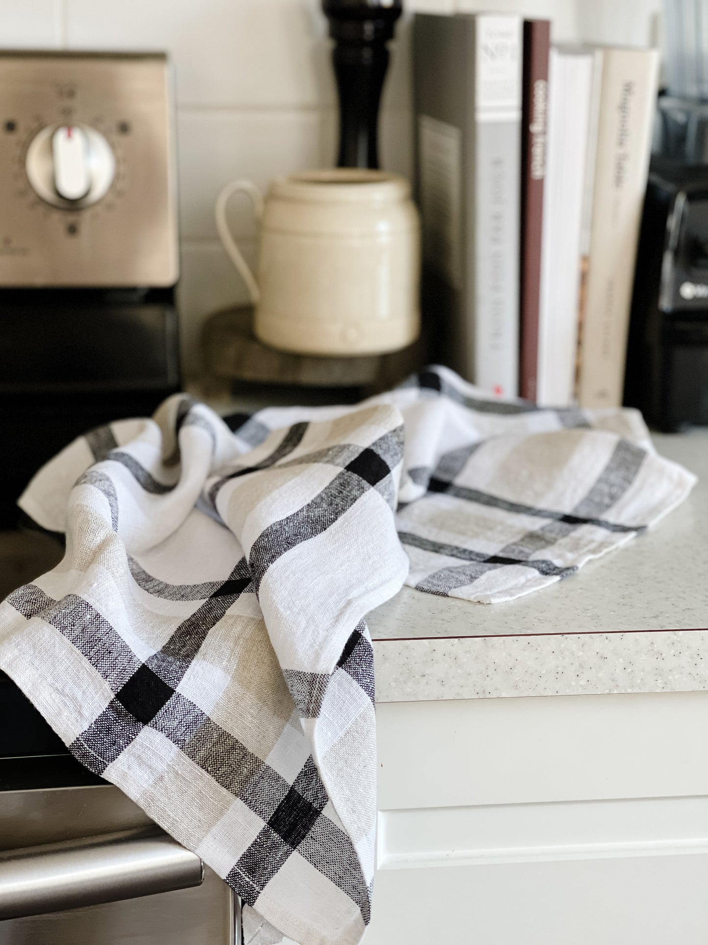 Black and beige check patterned linen kitchen towel on countertop_LaMaisonBaude