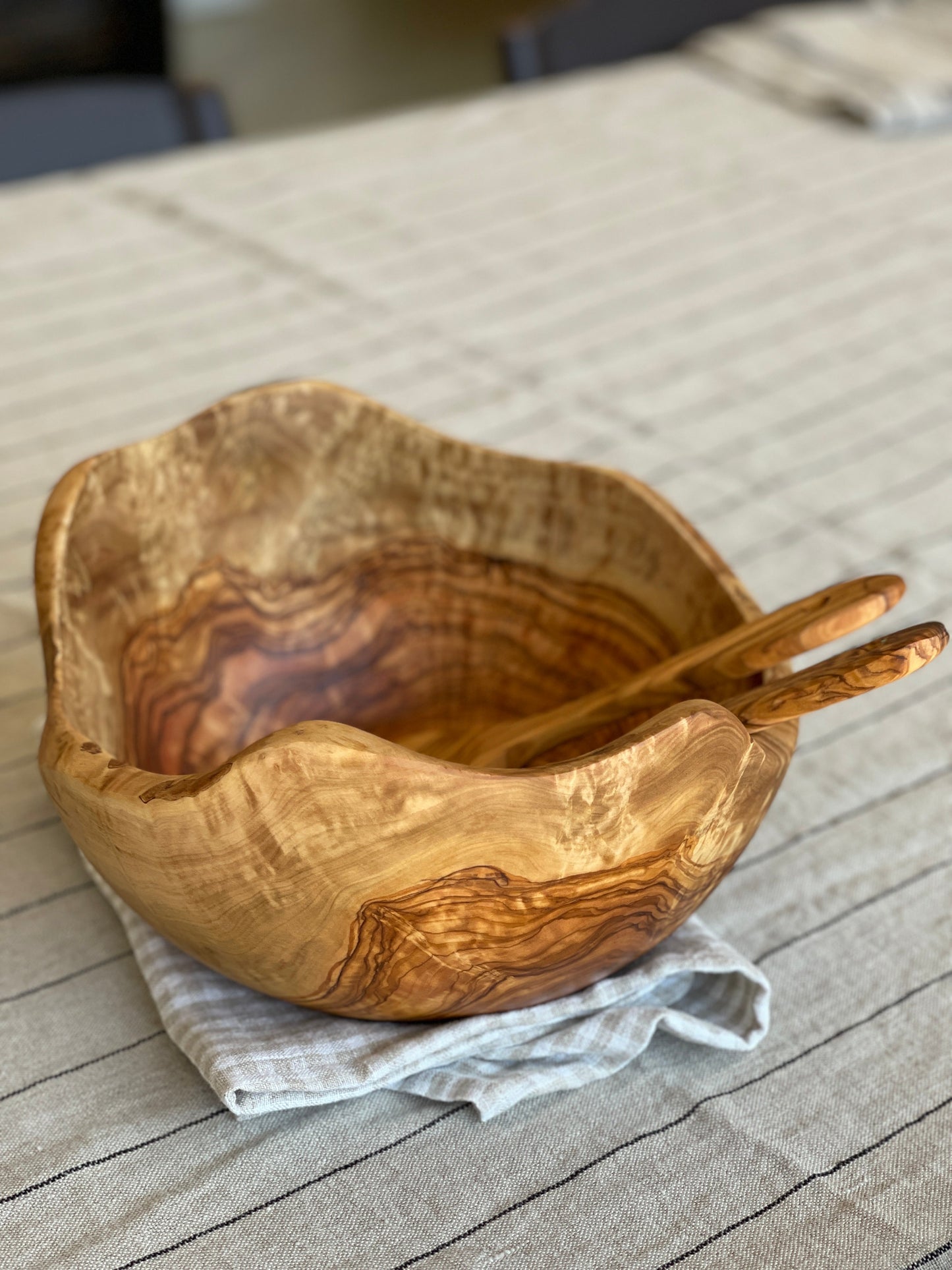 Olive wood salad bowl with serving spoons